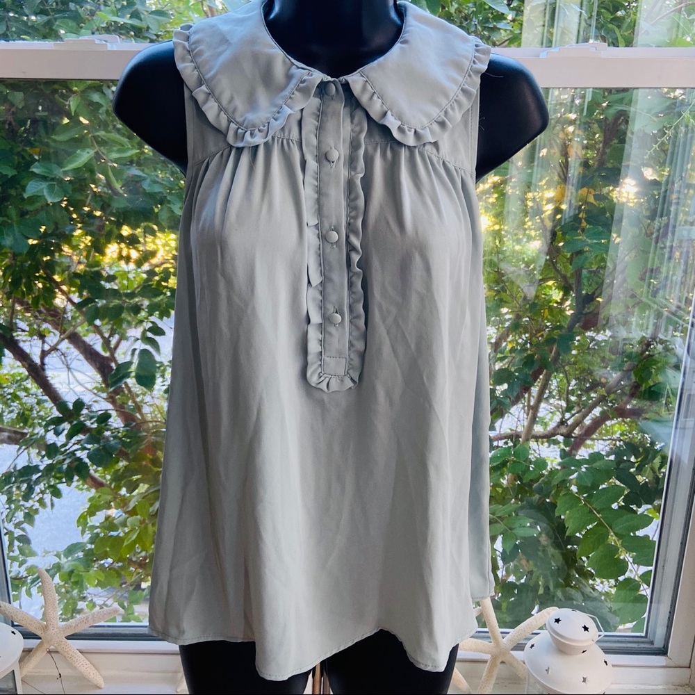 No sleeve peppermint green frilled top